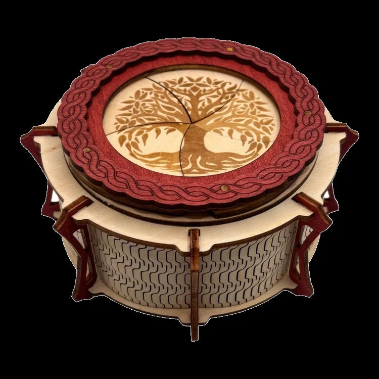 Boîte  ronde à mécanisme en bois, avec système d'ouverture ingénieux pour les esprits curieux. boite à bijoux, boite secrète.
De fabrication française et artisanale 